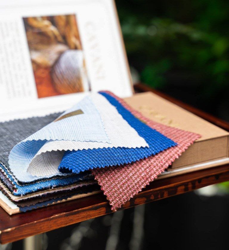 "Italian CAVANI linen and premium wool from Europe's finest mills"